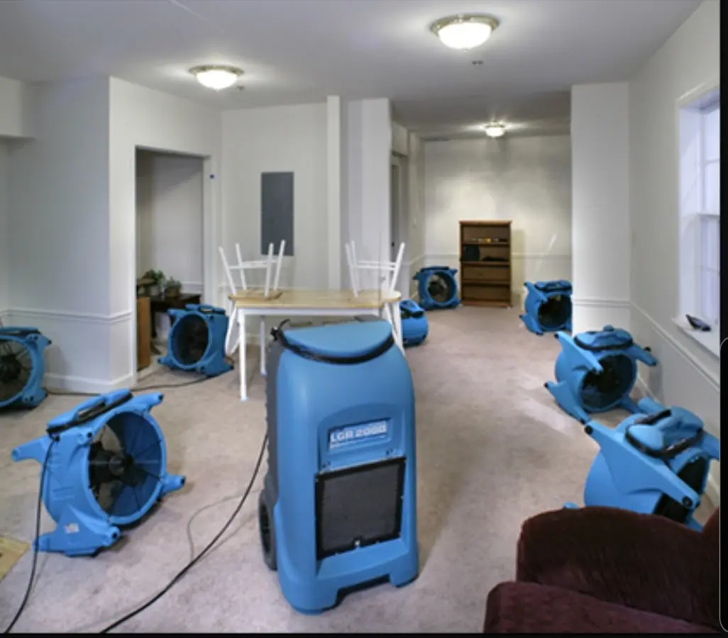 Air movers and dehumidifier setup for Water Damage Restoration in Monaca